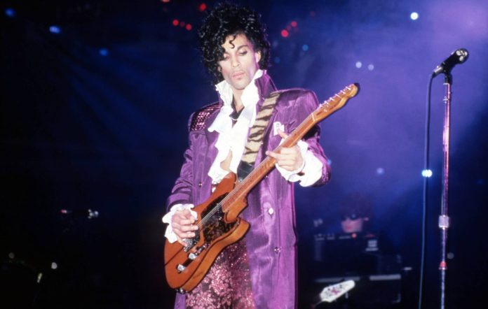 American singer, songwriter, musician, record producer, dancer, actor, and filmmaker Prince (1958-2016) performs onstage during the 1984 Purple Rain Tour on November 4, 1984, at the Joe Louis Arena in Detroit, Michigan. (Photo by Ross Marino/Getty Images)